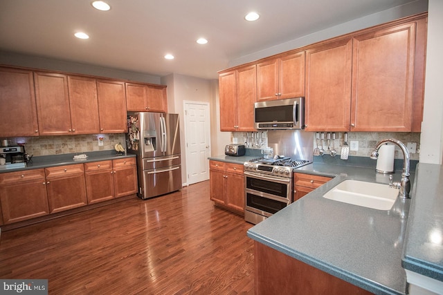23371 Hosta Ln, California, MD 20619 - kitchen with appliances with stainless steel finishes, a sink, recessed lighting, backsplash, and dark countertops