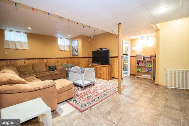23371 Hosta Ln, California, MD 20619 - living area with a wainscoted wall, a paneled ceiling, and wood walls