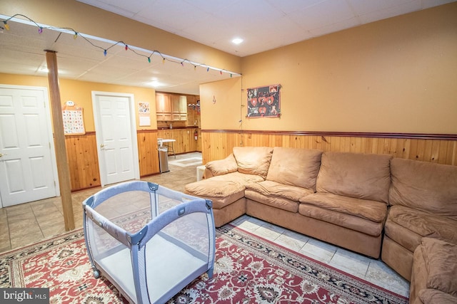 23371 Hosta Ln, California, MD 20619 - living area with wainscoting, wooden walls, and light tile patterned flooring