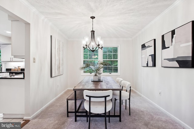 dining room featuring a chandelier, carpet flooring, baseboards, ornamental molding, and a textured ceiling
