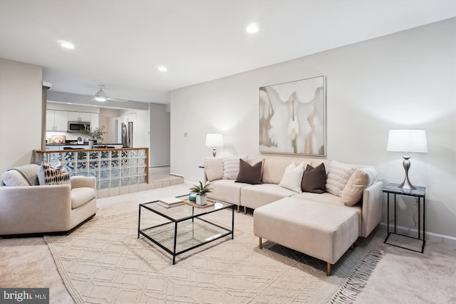 living area with light colored carpet, recessed lighting, ceiling fan, and baseboards