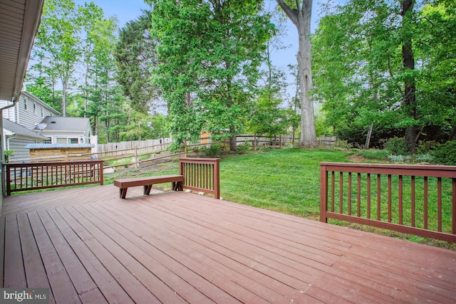 wooden deck featuring view of scattered trees