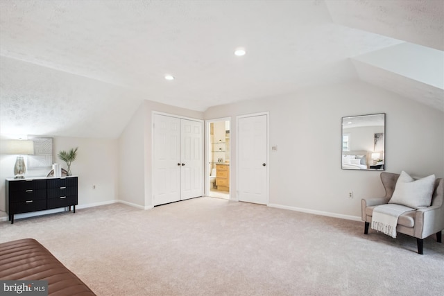 living area with vaulted ceiling, light carpet, baseboards, and recessed lighting