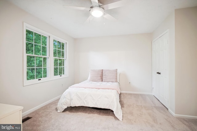 bedroom with carpet floors, baseboards, and ceiling fan