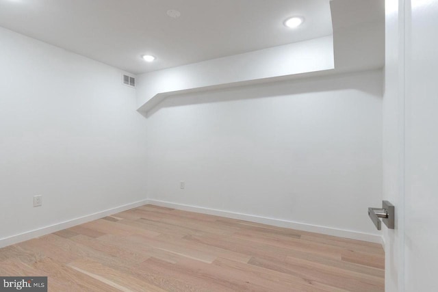 interior space featuring light wood finished floors, baseboards, visible vents, and recessed lighting