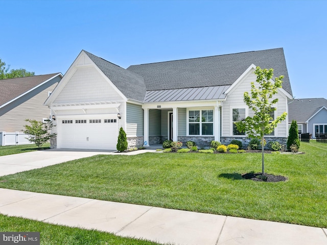 35015 Kindleton Ln, Lewes, DE 19958 - view of front of property with an attached garage, stone siding, driveway, a front lawn, and a standing seam roof