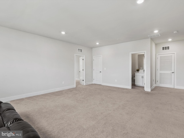 35015 Kindleton Ln, Lewes, DE 19958 - unfurnished living room with recessed lighting, baseboards, and light carpet