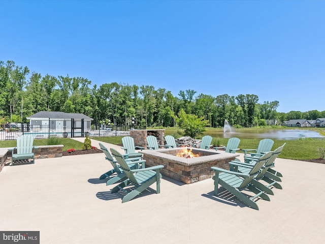 35015 Kindleton Ln, Lewes, DE 19958 - view of patio with a fire pit and a water view