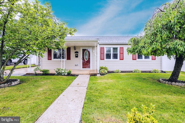 1020 Thomas Rd, Glen Burnie, MD 21060 - view of front of property with a front lawn and roof with shingles