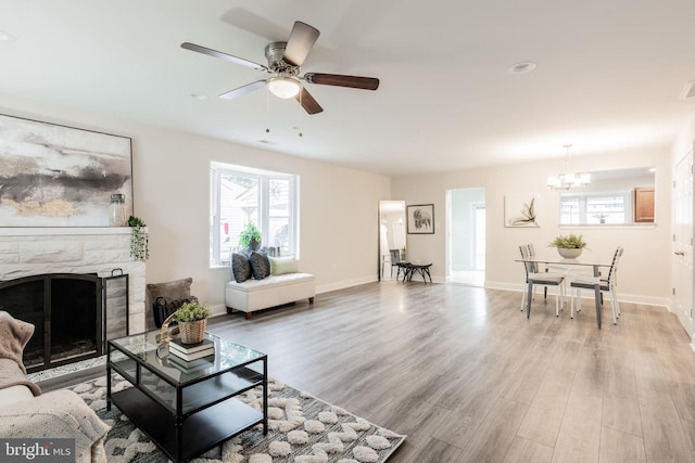 1020 Thomas Rd, Glen Burnie, MD 21060 - living area featuring a chandelier, healthy amount of natural light, light wood-type flooring, and a ceiling fan