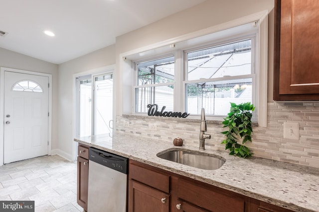 1020 Thomas Rd, Glen Burnie, MD 21060 - kitchen featuring dishwasher, a sink, tasteful backsplash, lofted ceiling, and baseboards