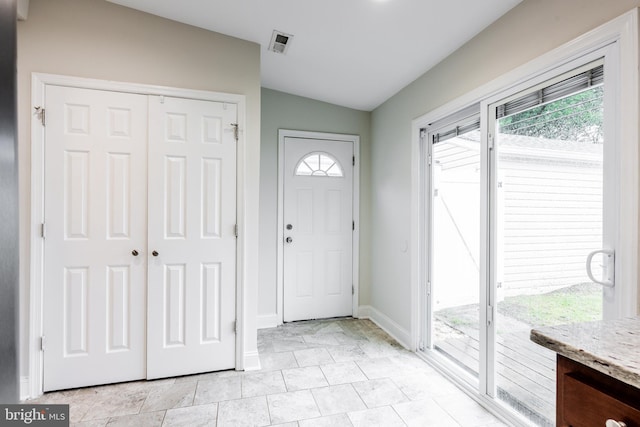 1020 Thomas Rd, Glen Burnie, MD 21060 - entryway featuring lofted ceiling, healthy amount of natural light, and baseboards