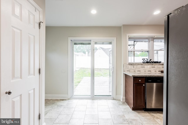 1020 Thomas Rd, Glen Burnie, MD 21060 - kitchen with appliances with stainless steel finishes, baseboards, plenty of natural light, dark brown cabinets, and recessed lighting