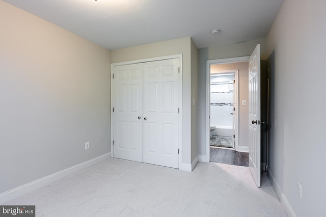 1020 Thomas Rd, Glen Burnie, MD 21060 - unfurnished bedroom featuring carpet floors, a closet, and baseboards