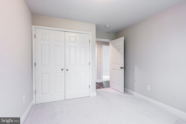 1020 Thomas Rd, Glen Burnie, MD 21060 - unfurnished bedroom featuring carpet floors, a closet, and baseboards