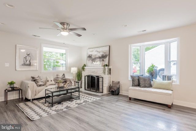 1020 Thomas Rd, Glen Burnie, MD 21060 - living area with a ceiling fan, baseboards, wood finished floors, and a fireplace with flush hearth