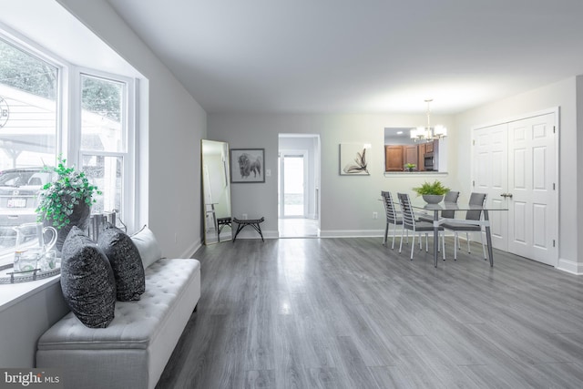 1020 Thomas Rd, Glen Burnie, MD 21060 - dining space featuring a chandelier, baseboards, and wood finished floors