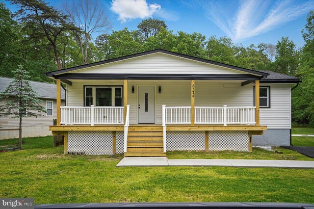 8224 Old Mill Rd, Pasadena, MD 21122 - view of front of home featuring a porch and a front yard