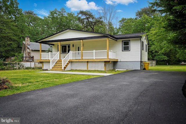 8224 Old Mill Rd, Pasadena, MD 21122 - view of front facade featuring a porch, a front yard, stairway, and roof with shingles