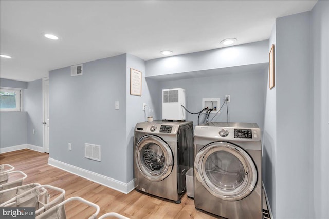628 Mason Ave, Drexel Hill, PA 19026 - laundry area with washing machine and dryer, wood finished floors, baseboards, and recessed lighting