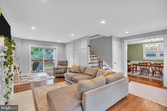 628 Mason Ave, Drexel Hill, PA 19026 - living area featuring a chandelier, stairs, wood finished floors, baseboards, and recessed lighting