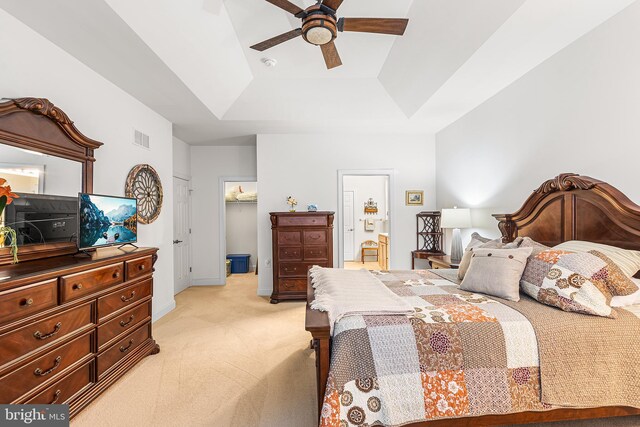 606 Garden Gate Dr, Middletown, DE 19709 - bedroom with a tray ceiling, light carpet, a spacious closet, baseboards, and ceiling fan