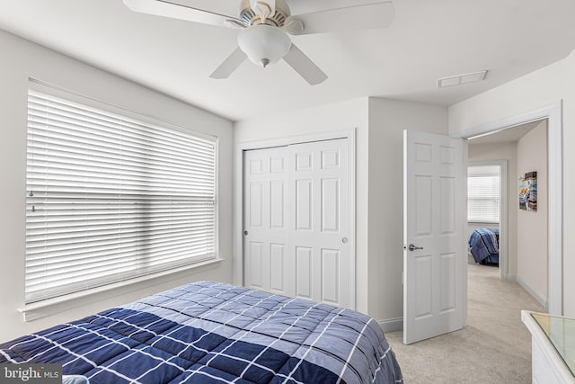 606 Garden Gate Dr, Middletown, DE 19709 - bedroom with light colored carpet, a closet, baseboards, and ceiling fan