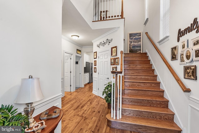 606 Garden Gate Dr, Middletown, DE 19709 - staircase featuring ornamental molding and wood finished floors