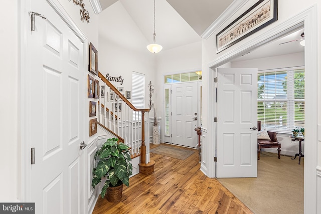 606 Garden Gate Dr, Middletown, DE 19709 - entrance foyer featuring stairway, vaulted ceiling, and light wood finished floors