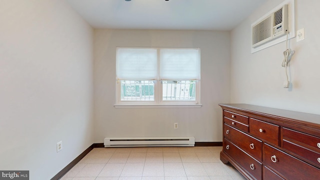 bedroom with baseboards, a baseboard radiator, and a wall mounted air conditioner