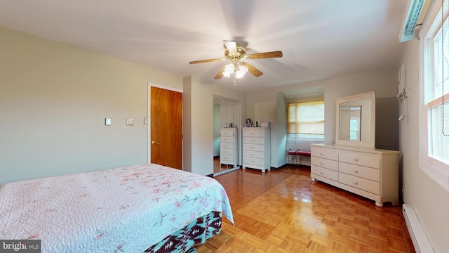 bedroom featuring baseboards, baseboard heating, and ceiling fan