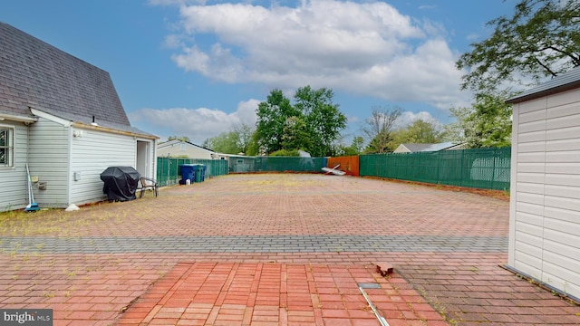 view of patio / terrace with a fenced backyard and area for grilling