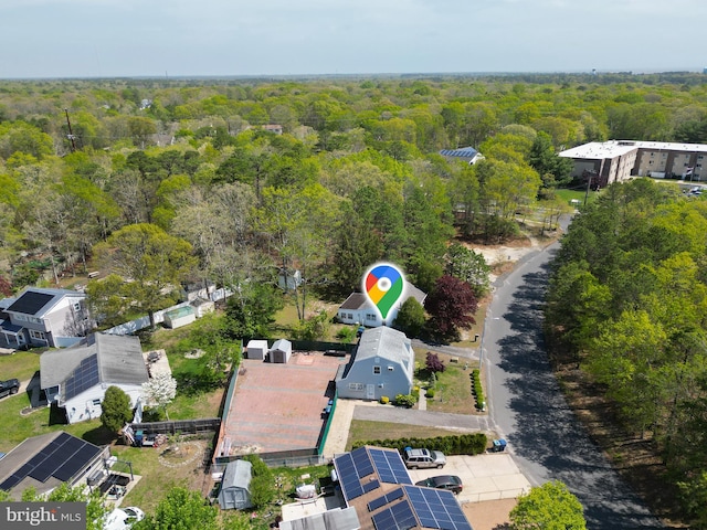 drone / aerial view with a view of trees