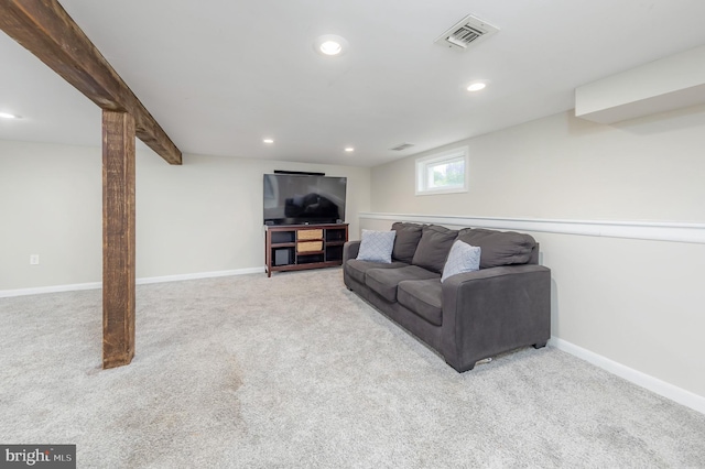 carpeted living room with recessed lighting and baseboards