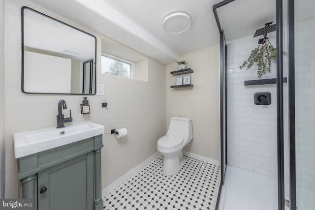 full bath with a shower stall, baseboards, toilet, and vanity