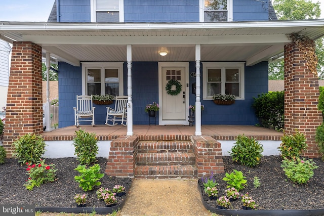 property entrance featuring covered porch