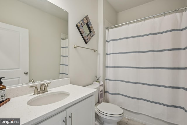 full bath featuring toilet, tile patterned flooring, vanity, and curtained shower