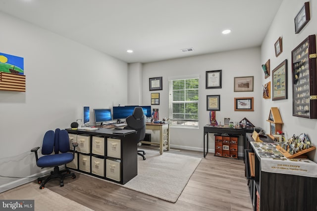 office featuring recessed lighting, baseboards, visible vents, and wood finished floors