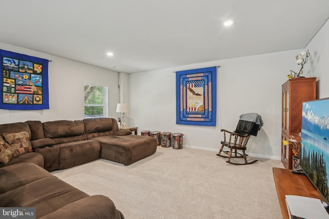 living area featuring carpet, baseboards, and recessed lighting