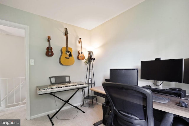 carpeted office featuring baseboards