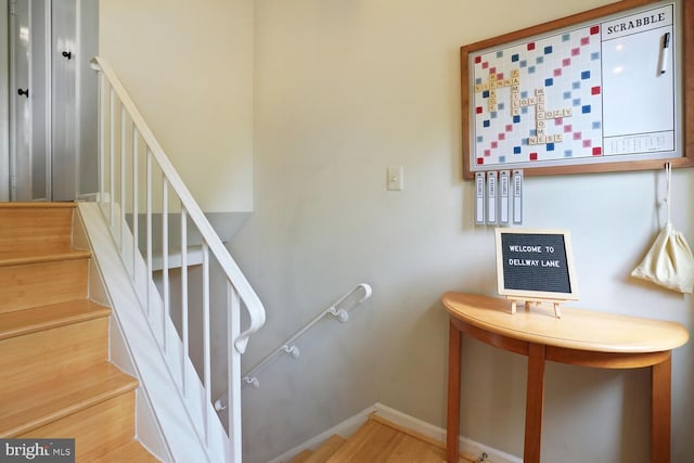 stairs with wood finished floors