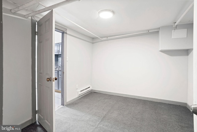 walk in closet with a baseboard radiator and carpet floors