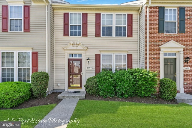 1007 Whispering Ponds Ct, Salisbury, MD 21804 - townhome / multi-family property with a front lawn