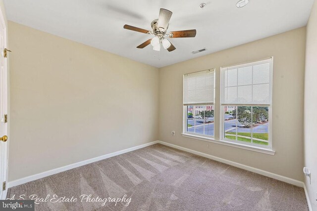 1007 Whispering Ponds Ct, Salisbury, MD 21804 - spare room featuring baseboards, carpet floors, and a ceiling fan