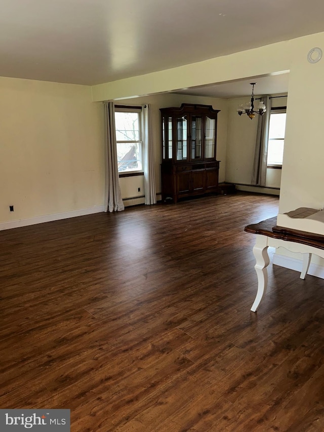 1535 Fieldwood Rd, Southampton, PA 18966 - unfurnished living room featuring a chandelier, dark wood-style floors, a baseboard radiator, and baseboards
