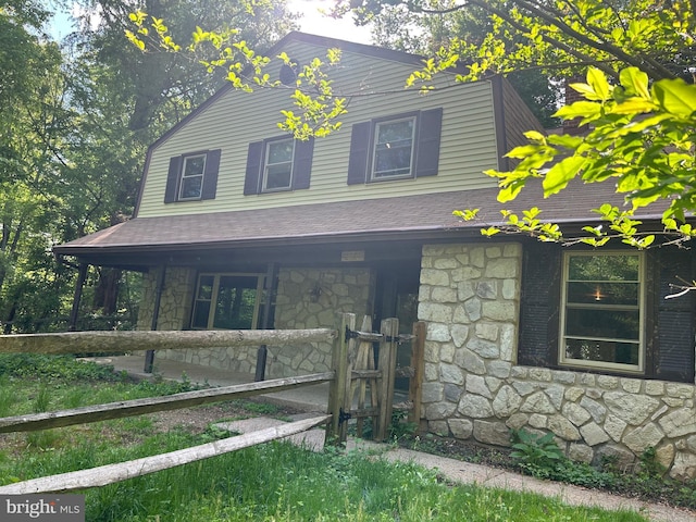1535 Fieldwood Rd, Southampton, PA 18966 - view of home's exterior featuring stone siding, covered porch, and a shingled roof
