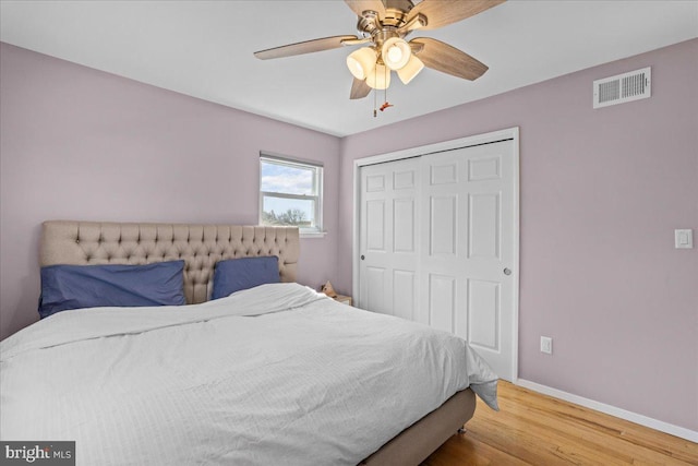 48 Creighton Cir, Old Bridge, NJ 08857 - bedroom with wood finished floors, a closet, baseboards, and ceiling fan
