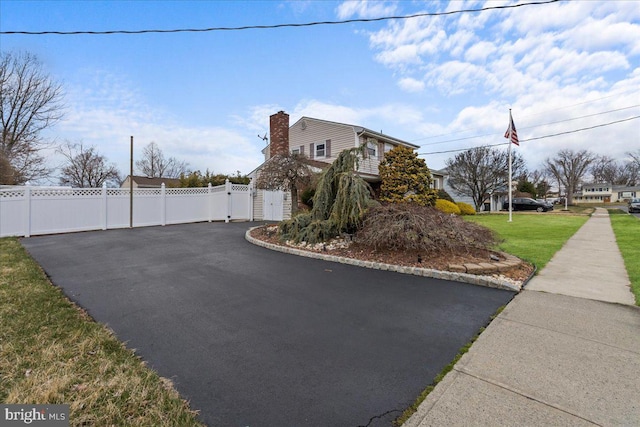 48 Creighton Cir, Old Bridge, NJ 08857 - view of side of property featuring a gate and a chimney