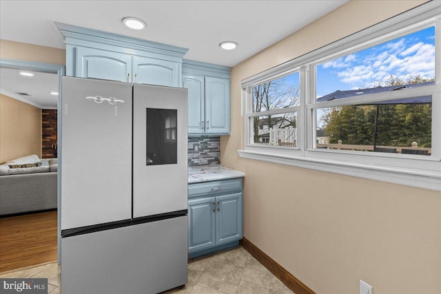 48 Creighton Cir, Old Bridge, NJ 08857 - kitchen featuring smart refrigerator, light tile patterned flooring, blue cabinets, tasteful backsplash, and baseboards
