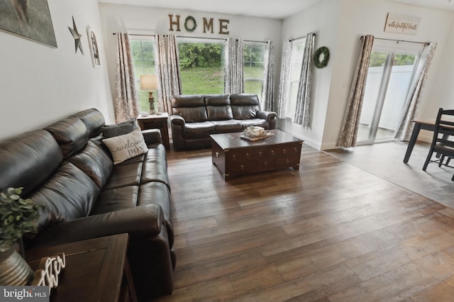 living area featuring dark wood finished floors and baseboards